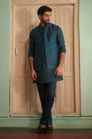 Teal blue silk bundi with sequins hand embroidery. - Aza Fashions Embroidered Cotton Silk Nehru Jacket Fitted, Fitted Embroidered Nehru Jacket In Cotton Silk, Embroidered Cotton Silk Fitted Nehru Jacket, Fitted Cotton Silk Bandhgala With Cutdana, Embroidered Fitted Nehru Jacket In Cotton Silk, Blue Chanderi Bandhgala For Wedding, Designer Chanderi Nehru Jacket Fitted, Fitted Chanderi Nehru Jacket For Designer Wear, Festive Cotton Silk Fitted Nehru Jacket