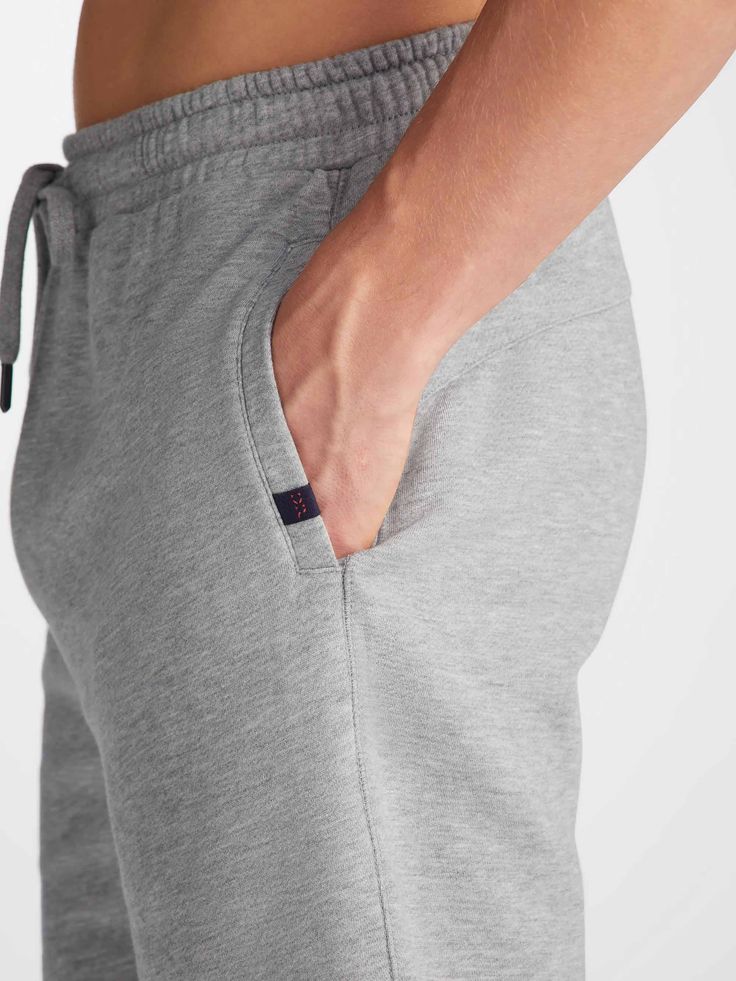 Seen here in a classic silver, our Quinn sweat shorts ensure all-day-long comfort. Featuring a combined elastic and tie waistband, our sweats also feature two front side pockets and a zipped back pocket to keep your phone and essentials close whilst you're out and about. Stylish, yet practical. The Quinn fabric combines all the key qualities of our cotton and micro modal; it's durable and has great colour retention, meaning it can withstand long-lasting wear and won't fade in colour. It's thermo Short Gown Dress, Cashmere Loungewear, Holiday Capsule Wardrobe, Mens Sweat Shorts, Cotton Dressing Gown, Silk Dressing Gown, Long Gown Dress, Merino Sweater, Matching Family Pajamas