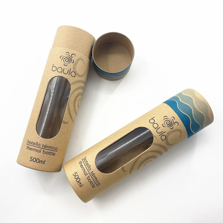 two cardboard tubes with one tube open and the other empty, on a white surface