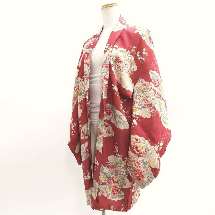 This is a pre-owned authentic Japanese kimono garment. This is a absolutely stunning genuine Japanese Antique Silk Haori. The fabric is a mid-lightweight Silk, smooth-textured with a lustrous finish typical rinzu fabric. Great to wear and enjoy as a very old traditional costume, also perfect for an unique antique wall art. Discoloration (See picture). This kimono has "Shitsuke-ito"(white stitching), to keep garment neat during long periods of storage, it just gets pulled out prior to wearing. #1 Total Length : 84cm/33.1 inches #2 Center to the edge of the sleeve : 62cm/24.4inches #3 Center to Shoulder : 30cm/11.8inches #4 Sleeve Length : 48cm/18.9inches Material: Silk Color: Light Red -Important Notice- All items in my store are used and vintage items. These are not like new mass-produced Vintage Floral Print Kimono, Red Long Sleeve Kimono With Floral Print, Red Floral Print Long Sleeve Kimono, Red Vintage Kimono For Spring, Vintage Red Kimono For Tea Ceremony, Traditional Red Floral Print Kimono, Traditional Red Floral Kimono, Antique Wall Art, Haori Jacket