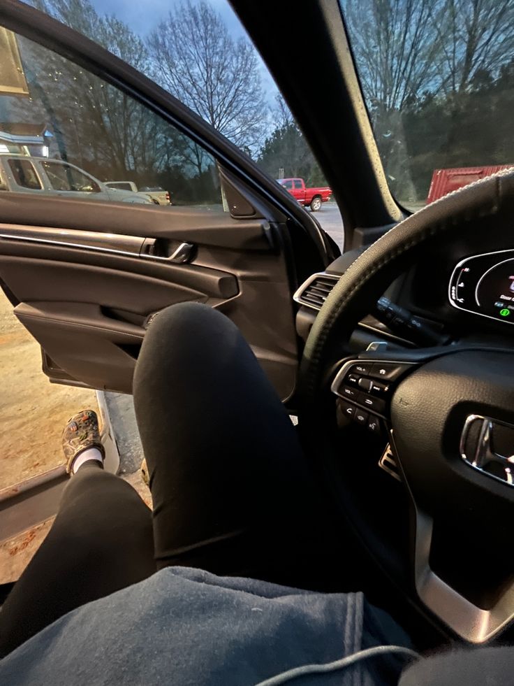 the interior of a car with dashboard and steering wheel view from driver's seat