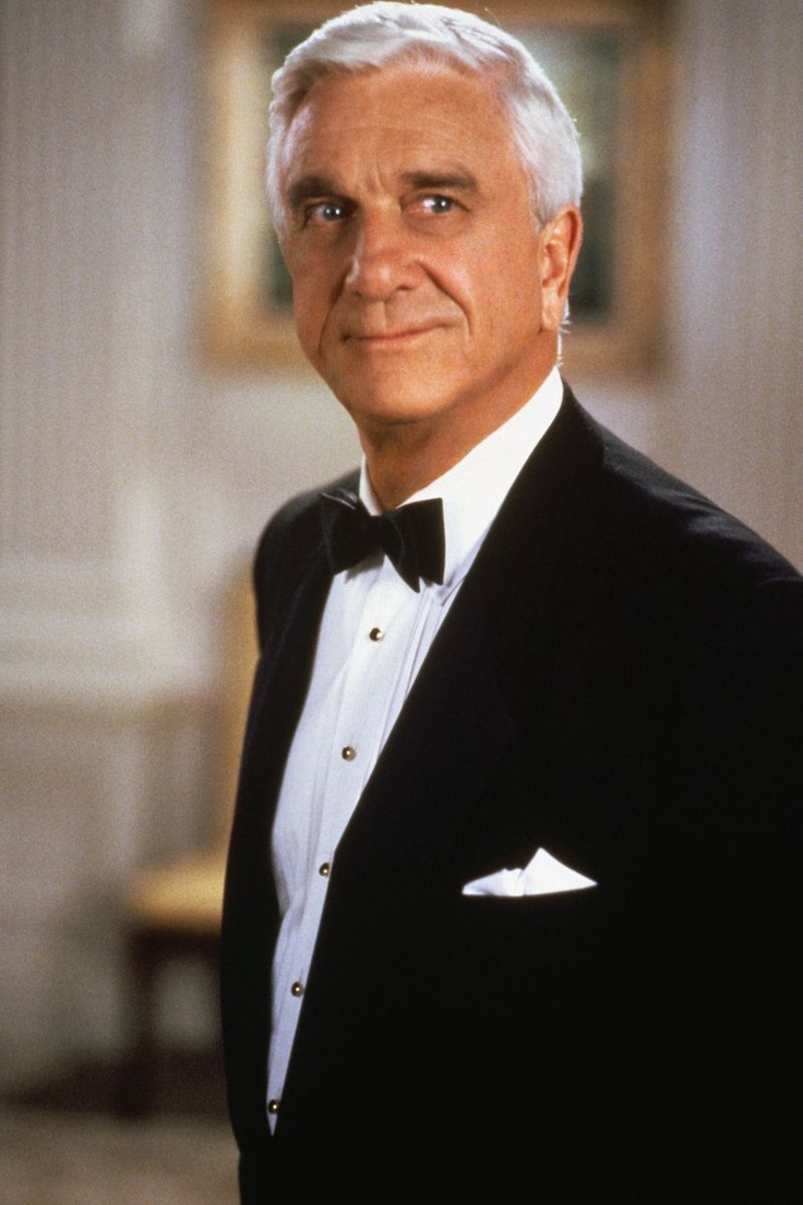 an older man wearing a tuxedo and bow tie