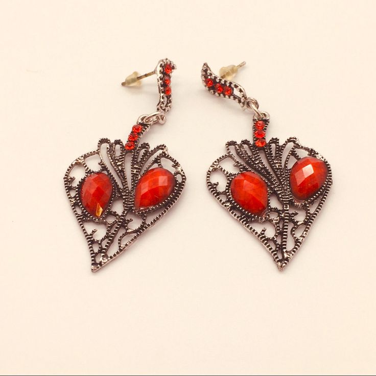 Long Red Earrings Red Metal Heart Earrings For Party, Red Heart-shaped Metal Earrings, Elegant Red Single Clip-on Earring, Vintage Red Heart Earrings For Pierced Ears, Handmade Red Clip-on Earrings For Party, Red Dangle Heart Earrings For Party, Red Vintage Heart Earrings, Red Single Earring For Formal Occasions, Red Metal Drop Earrings