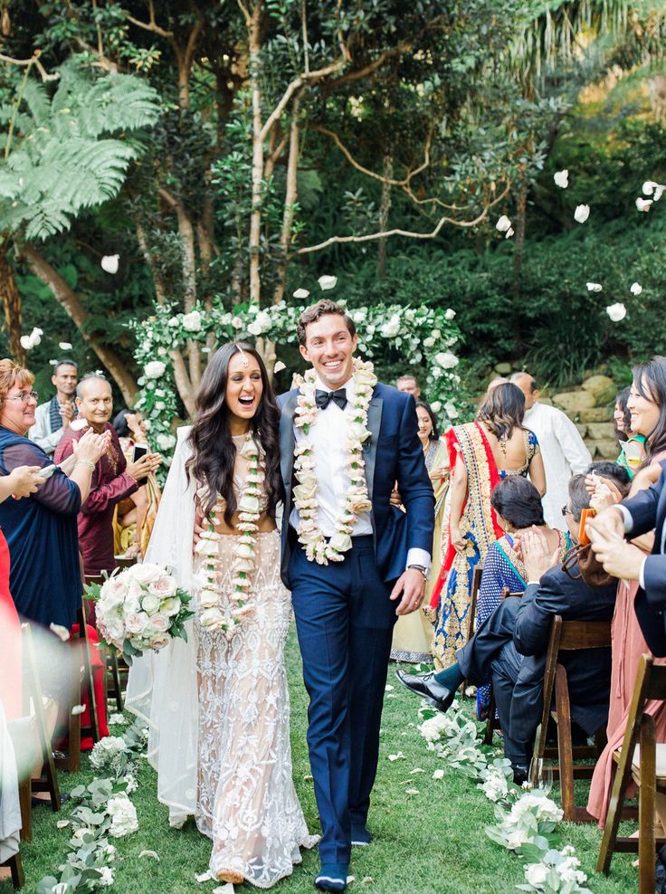 a newly married couple walking down the aisle