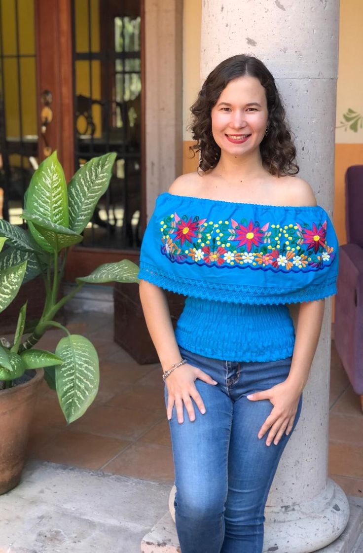 This beautiful Mexican peasant top with a spring at the waist and floral embroidery with bright colored threads will make you look spectacular. This blouse comes as a one size ideal for Small and Medium sizes. Blouse made by artisans from Oaxaca, so you can wear it on any occasion. Mexican textile art has centuries of history and creativity throughout the country. Mexico is recognized as one of the leading countries with a beautiful aristic production in the textile world, miraculous hands of ta Peasant Blouse With Floral Embroidery For Vacation, Bohemian Peasant Top With Floral Embroidery, Peasant Style Embroidered Top With Geometric Embroidery For Spring, Spring Bohemian Top With Intricate Embroidery, Bohemian Blue Tops With Intricate Embroidery, Peasant Style Embroidered Top For Vacation, Blue Folk Style Top For Spring, Blue Folk Top For Spring, Peasant Tops With Multicolor Embroidery For Vacation