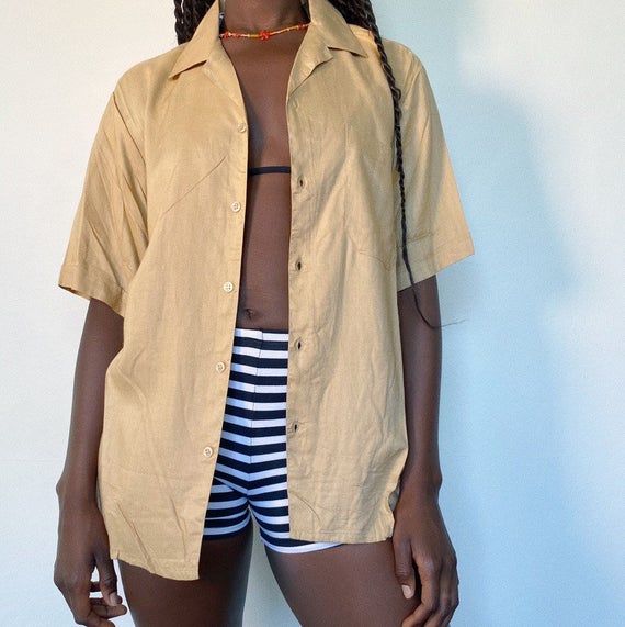 90s button up shirtThe trend for summerr! Wear it open, half done up with a mini skirt or tied up with some high waisted jeans.In a light weight material, beige is also a colour that you can match with everything! ..No marked size Modelled on a size 8...#buttonup #shirt #90s #y2k Women’s Button Up Shirt, Beige Button-up Beach Shirt, Beige Button-up Shirt For Beach, Beige Collared Shirt For Summer, Beige Collared Summer Shirt, Summer Button Up, Beige Summer Shirt For Vacation, Beige Summer Shirt With Button Closure, Beige Short Sleeve Camp Shirt For Spring