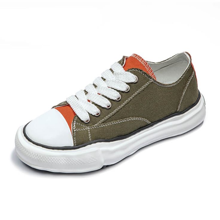 Elevate Your Summer Style with Miami Coastal Low Top Canvas Sneakers Looking for a stylish and comfortable pair of sneakers to wear this summer? Look no further than the Miami Coastal Low Top Canvas Sneakers! These sneakers are the perfect blend of classic and modern style, with their newly designed dissolving canvas material and softer EVA outsole. The Miami Coastal Low Top Canvas Sneakers come in two eye-catching colorways - green with an orange tongue and solid blue. The green upper is made f