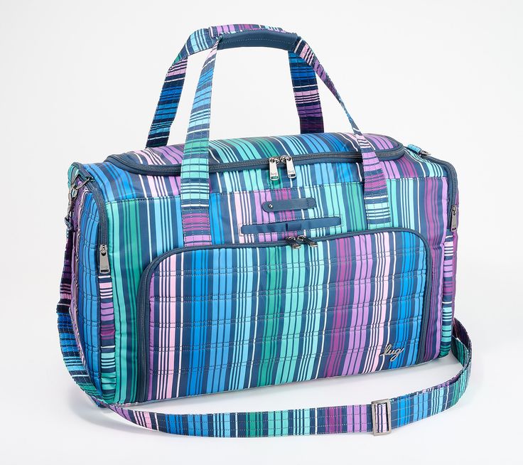 When packing for a weekend getaway, you don't have to choose between style and space with the Lug Oversized Weekender Bag in the trolley duffel style. Fully decked out with pockets galore, this lined bag ensures you have enough room to pack for the whole family with some space left over for souvenirs or last-minute purchases.   Apart from all that storage, the Lug Oversized Weekender Bag is designed to make traveling as comfortable and stress-free as possible. To ensure your valuables are safely Rectangular Travel Bag With Reinforced Handles For Weekend Trips, Travel Tote With Reinforced Handles, Travel Tote Bag With Reinforced Handles, Rectangular Weekender Bag With Reinforced Handles For Travel, Rectangular Travel Bag With Pockets For Weekend, Weekend Travel Bag With Pockets, Rectangular Luggage With Sleeve For Weekend, Rectangular Luggage With Luggage Sleeve For Weekend, Rectangular Travel Bag With Luggage Sleeve For Weekend