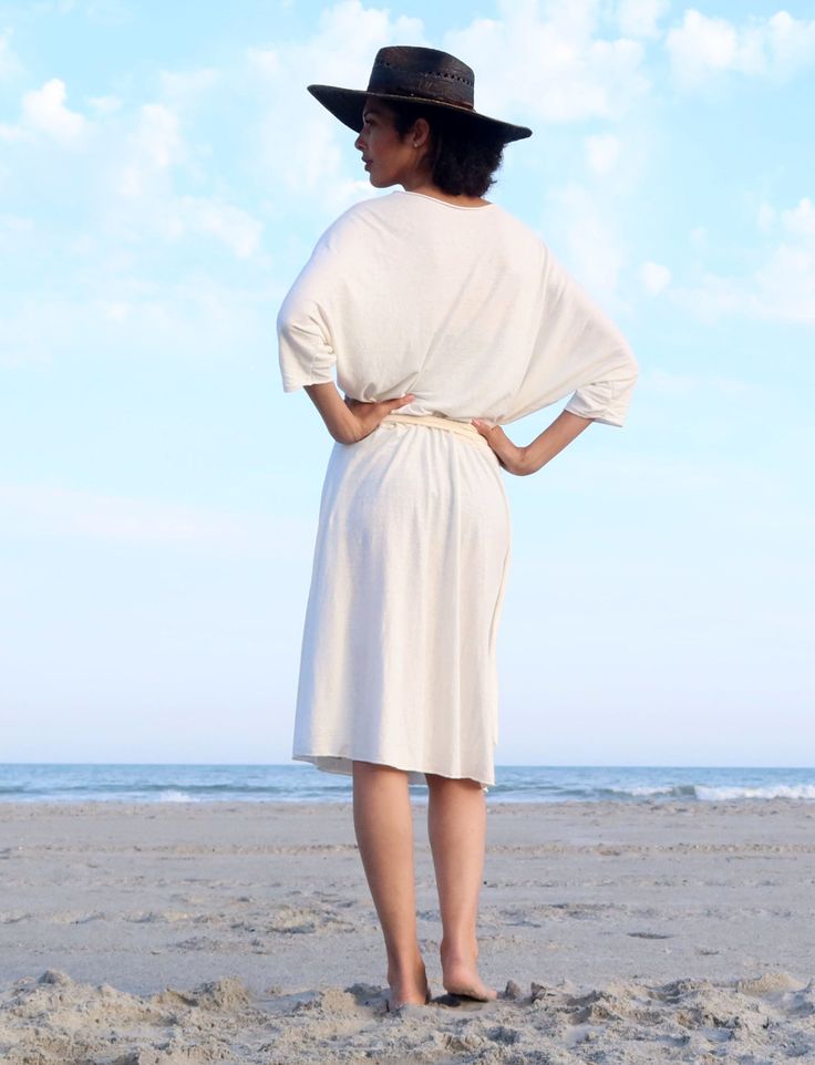 Shape - The Butterfly Wrap criss-crosses in front to create a deep V neckline attached to wrappable ties. This open dolman silhouette is perfect for layering and oh-so-sexy on its own. Size - Order based on BUST measurement Fabric Shown - Light Hemp/Organic Cotton Knit Color Shown - Natural Fitted V-neck Beach Cover-up Dress, Beachy V-neck Relaxed Fit Cover-up, Beige V-neck Wrap Dress For The Beach, Cream V-neck Beach Cover-up Dress, Beige V-neck Wrap Dress, Gaia Conceptions, Above Elbow, Elbow Sleeve, Fabric Bolts