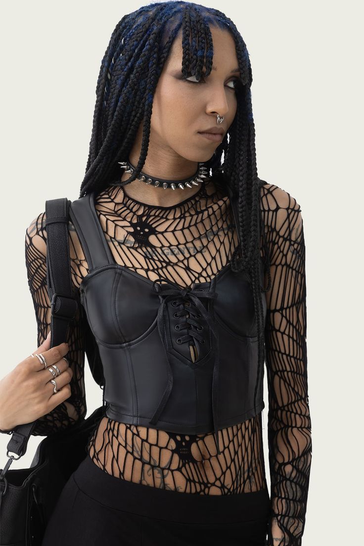 MOONLESS.- Smooth PU corset.- Wide shoulder straps.- Cropped.- Lace up detail.- Back zip closure.- Fitted.With KIHILIST branding, 60% Polyurethane 40% Polyester, Excluding Trims.Hand wash delicate (30°C) / Do not bleach / Do not tumble dry / Do not iron / Do not dry clean. Imported. Edgy Club Corset With Zipper Closure, Faux Leather Corset With Corset Back, Faux Leather Corset For Club, Edgy Corset Belt For Alternative Fashion, Punk Corset For Alternative Fashion, Black Halloween Corset For Concert, Faux Leather Club Corset, Edgy Corset With Corset Back For Alternative Fashion, Black Punk Corset With Straps