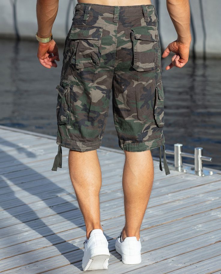 URBAN CLASSICS army patterned shorts. Cargo model with thigh pockets, two front pockets and buttoned back pockets. Fit for Finns, with longer legs and the possibility of tightening in pounds. Zip fastening in the forging. Military Khaki Shorts With Pockets, Military Style Cargo Shorts With Side Pockets, Military Cargo Shorts With Side Pockets, Khaki Knee-length Shorts With Side Pockets, Military Style Cargo Shorts, Military Style Shorts For Outdoor With Pockets, Military Style Khaki Shorts With Side Pockets, Military Style Shorts With Multiple Pockets For Summer, Military Style Summer Shorts With Multiple Pockets