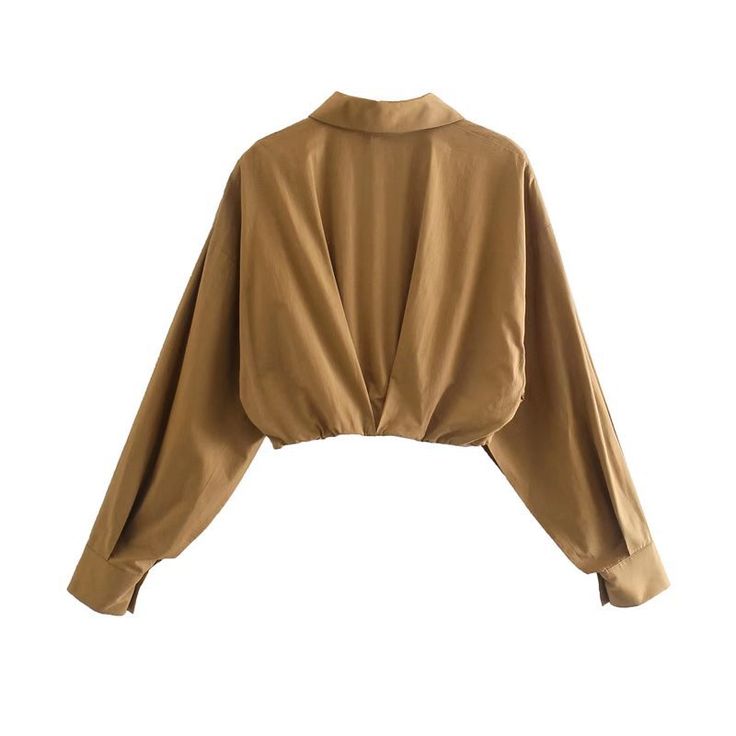 Our Long Sleeve Crop Top will make you feel so much more comfortable and confident. It’s made from soft and stretchy cotton material and has a collar that goes around your neck. It’s versatile for any occasion, whether it be under a jacket or with boots for a day of exploring the city. Brown V-neck Solid Color Top, Brown Solid Color V-neck Top, Chic Beige Long Sleeve Crop Top, Chic Long Sleeve Beige Crop Top, Trendy Cropped Beige Top, Fitted Brown Solid Color Top, Solid Color Fall Crop Top, Fitted Solid Brown Tops, Fall Solid Color Crop Top