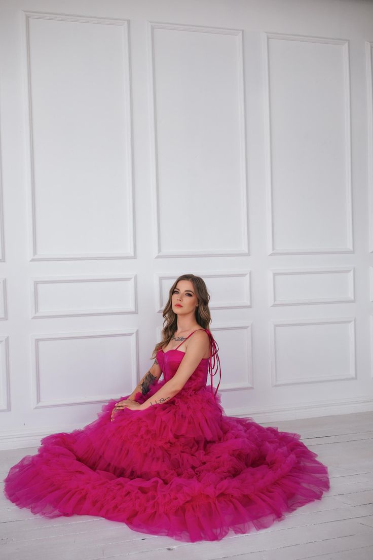 This hot pink princess dress will make you feel like you stepped straight out of a fairy tale. With its floor length and voluminous design,  it's perfect for any romantic occasion, from weddings to proms.  The small velvet belt and bow ties add unique and beautiful touches,  making you look and feel majestic.  (No awkward pumpkin coach rides here.) Message me for any kind of customizations. Pink Princess Dress For Quinceanera, Pink Tulle Bridesmaid Evening Dress, Pink Floor-length Ball Gown For Bridesmaid, Princess Style Tulle Gala Gown, Pink Princess Tulle Evening Dress, Pink Princess Ball Gown For Quinceanera, Princess Style Quinceanera Dress With Ruffles For Party, Pink Tulle Ball Gown For Prom, Princess Style Tulle Ball Gown For Gala