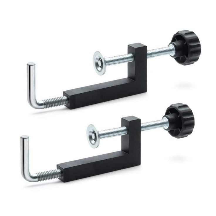 two black metal brackets with screws on them