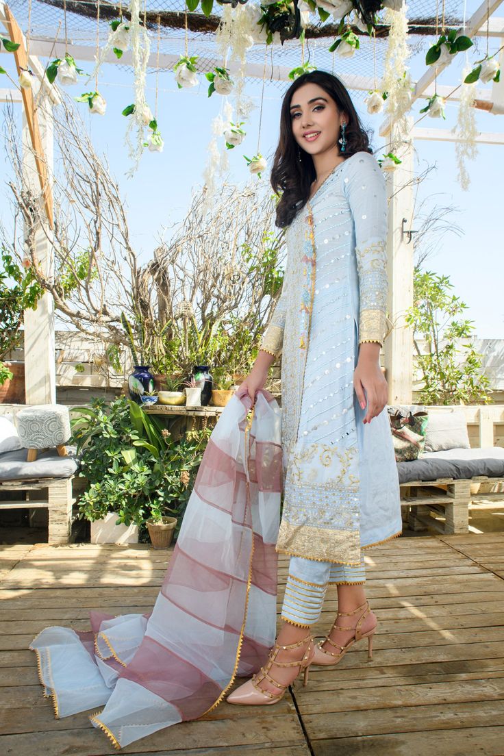 SKU: 1313 Price for Shirt, lining and Pants Chiffon embroidered fabric with mirror work is the perfect wear this summer. The ensemble has mirror work and the tassle is handcrafted with resham, pearls, and mirror. The color pallette is just so serene. Dupatta as is can be added to give a complete look for summer. Shirt length 45 Model is wearing XS. Spring Chanderi Salwar Kameez With Mirror Work, Spring Chanderi Anarkali Set With Mirror Work, Sheer Dupatta Palazzo Set For Festive Summer, Festive Palazzo Set With Sheer Dupatta For Summer, Spring Chanderi Palazzo Set With Mirror Work, Summer Festive Palazzo Set With Sheer Dupatta, Anarkali Sets With Mirror Work For Spring, Spring Anarkali Sets With Mirror Work, Summer Zari Work Georgette Sets