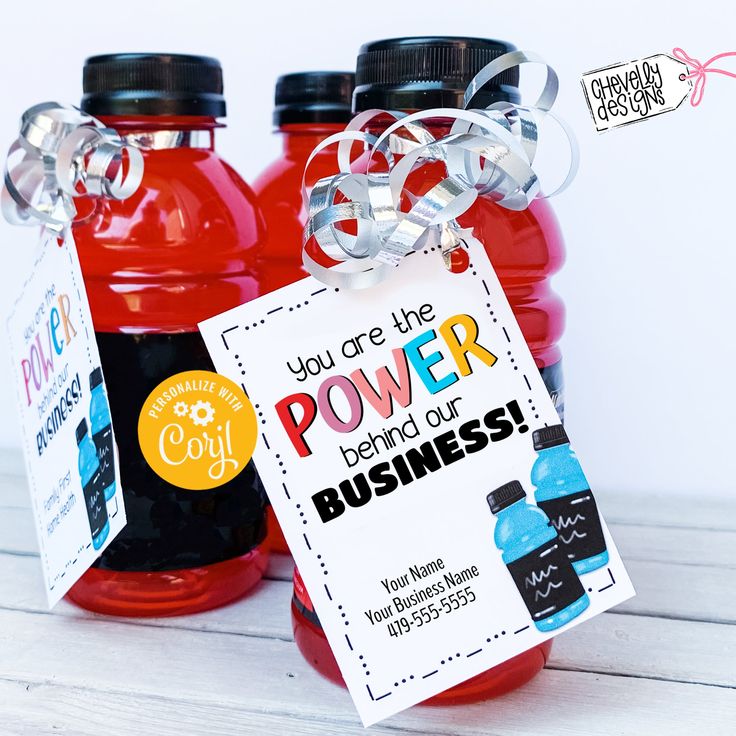 two red jars with labels on them are sitting next to each other, one has a label that says you are the power behind our business