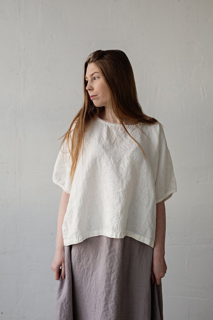 Tunic is made from 100% soft and washed linen. Match it with our skirts! Details: - Composition: 100% Oeko-Tex certified linen - Colour: white - Button in the back - Dropped shoulders - Size: One size/fits all - Medium weight linen - Linen care: machine wash gentle; tumble dry low, ironing optional - The price is for one tunic, other pictured items are not included Measurements: Length from neck down: 55 cm (21,66 in) Chest width: 140 cm (55,1 in) Sleeve length (from collar): 37 cm (14,6 in) Bot White Relaxed Fit Linen Tunic, Relaxed Fit Ramie Blouse For Daywear, Relaxed Fit Ramie Tops For Daywear, Linen Tops With Natural Dye And Short Sleeves, Short Sleeve Linen Tops With Natural Dye, White Relaxed Fit Blouse In Ramie, White Relaxed Fit Ramie Blouse, White Linen Short Sleeve Tunic, Daywear Linen Top In Flax Color