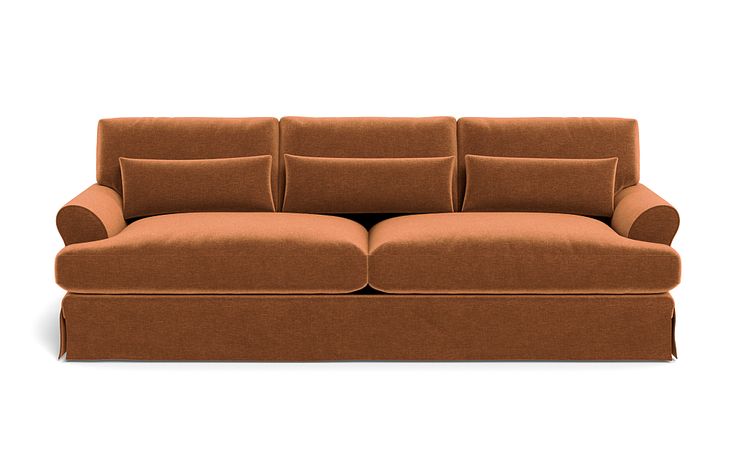 a brown couch sitting on top of a white floor