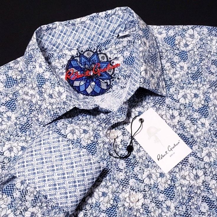 Robert Graham Geometric Floral White Blue Long Sleeve Sports Shirt Men's L Brand New With Tags Retail $198 Approximate Flat Lay Measurements Armpit-Armpit: 24" Top-Bottom: 32" Details Point Collar Button-Front Closure Long Sleeves With Button Cuffs All Over Print Machine Wash Iteam Ships Sameday Or Nextday With Tracking Information. 100% Authentic Product Please View All Photos, Description And Details. Robert Graham Shirts Men, Luxury Blue Long Sleeve Tops, Luxury Long Sleeve Blue Shirt, Luxury Blue Long Sleeve Shirt, Luxury Blue Cotton Shirt, Luxury Blue Shirt With Spread Collar, Designer Blue Shirt With Spread Collar, Luxury Blue Shirt, Designer Fitted Blue Shirt