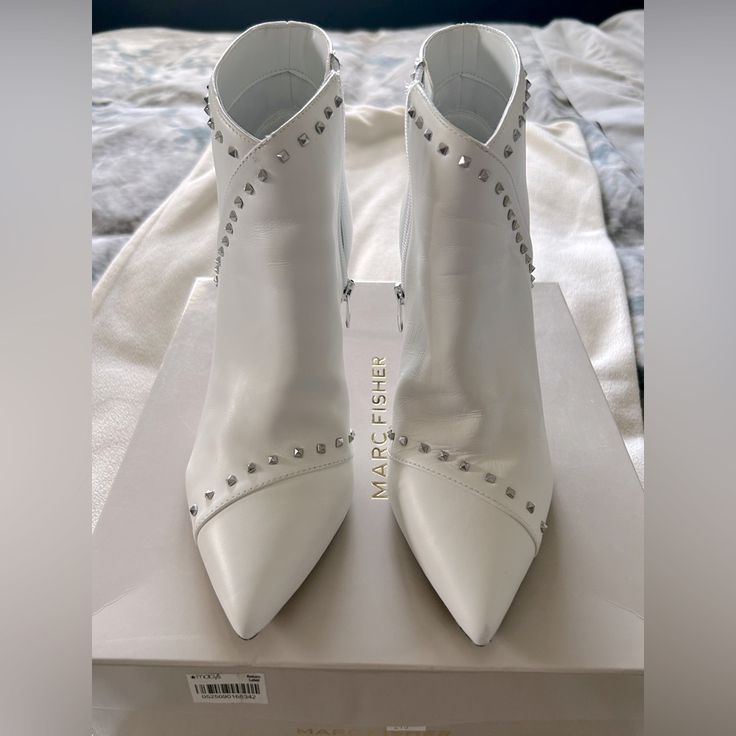 Never Worn. Brand New In Original Box. Size: 8 Color: White With Silver Studs Pyramid Studs And Angular Lines Dot The Sleek Silhouette 3 1/2” Heel Pointed-Toe Ankle Booties With Zipper Closure Studded Details At Trim Leather Upper; Manmade Lining; Manmade Sole White Closed Toe Booties For Party, Elegant Spring Fitted Booties, White Round Toe Booties For Party, White Round Toe Party Booties, Spring Formal Pointed Toe Booties, White Party Booties For Spring, Formal Spring Booties, White High Heel Booties For Party, White Ankle-high Party Booties