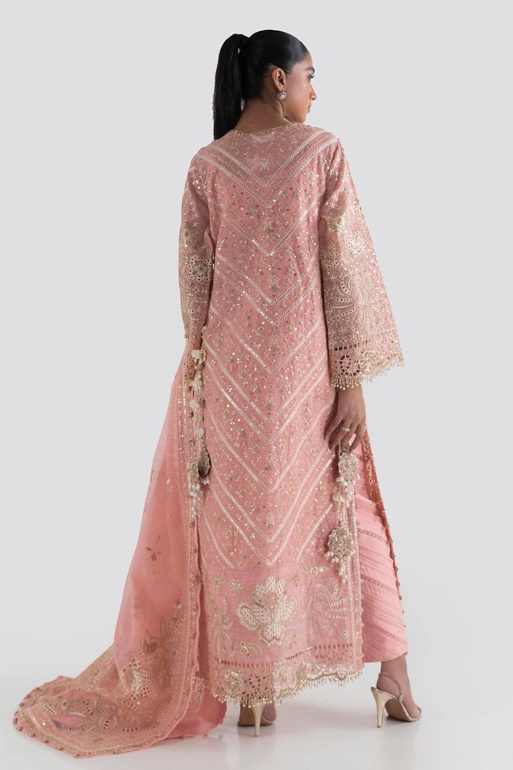 Peach Shade Luxury Pret Pakistani Party Wear Stunning Dress is Crafted with elaborate embroidery and shimmering ornaments, this graceful silhouette marries old world charm. Detailed Description: SKU: PB696 Detailing: Motifs, pearl, dabka, sequins Color: Peach Fabric: Chiffon, net, Silk Design: Fully embellished, Embroidery, Dabka Event: Festive, Party wear Formal Embellished Organza Embroidered Dress, Peach Reception Dress With Resham Embroidery, Traditional Peach Dress With Drape, Peach Resham Embroidery Dress For Reception, Peach Dress With Intricate Embroidery For Eid, Pink Raw Silk Party Dress, Pink Raw Silk Dress For Party, Traditional Peach Dress With Resham Embroidery, Embroidered Peach Anarkali Dress