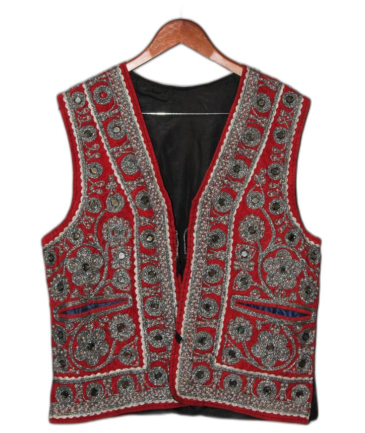 Made in Afghanistan, this a rare find vintage sleeveless waistcoat. Hand embroidery on velvet. A very antique piece in mint condition.  Measurements: Shoulder: 18 inch Chest: 21.5 inch Lenght: 26 inch Note: Worn and minor signs of wear. Festive Vest With Intricate Embroidery, Festive Sleeveless Vest With Intricate Embroidery, Sleeveless Embroidered Vest For Festive Occasions, Red Embroidered Sleeveless Vest, Sleeveless Vest With Intricate Embroidery For Festivals, Festive Embroidered Sleeveless Vest, Festive Bohemian Sleeveless Vest, Folk Style Sleeveless Vest For Festive Occasions, Folk Style Festive Sleeveless Vest