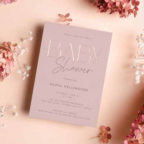 the baby shower is next to pink flowers on a pink background with silver foil lettering