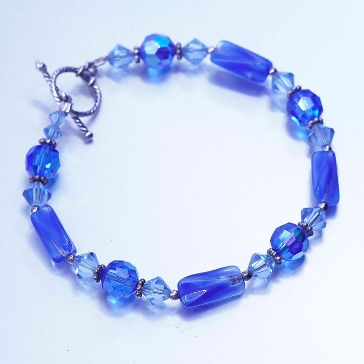 "7\", vintage Sterling 925 silver bracelet with blue crystal beads and toggle closure, silver tested" Elegant Blue Faceted Crystal Bracelet, Adjustable Blue Sterling Silver Bracelet With Silver Beads, Blue Crystal Bracelet With Lobster Clasp And Round Beads, Blue Crystal Bracelet With Round Beads And Lobster Clasp, Handmade Blue Sterling Silver Beaded Bracelets, Adjustable Blue Bracelet With Sterling Silver Clasp, Handmade Adjustable Blue Sterling Silver Bracelet, Adjustable Sterling Silver Blue Beaded Bracelet, Adjustable Blue Sterling Silver Beaded Bracelet