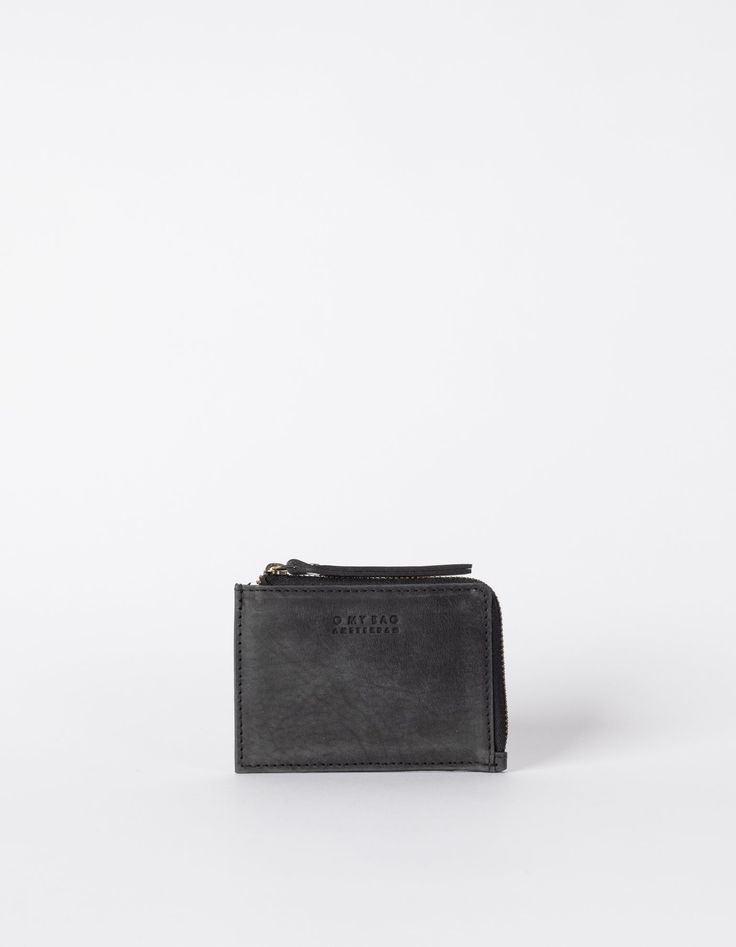 Looking for a small pouch that fits all your coins and credit cards? Look no further, we’ve got you covered. Our Coin Purse is the perfect mini-wallet that you can take with you everywhere. It’s finished in beautiful eco-leather in a choice of colors and decorated with our O My Bag Amsterdam logo. The Coin Purse’s Black color is timeless yet totally on-trend, it is versatile but neutral. From dresses to jeans, it simply matches everything. Pack this purse neatly inside of your bag, or carry it s Minimalist Black Wallet With Coin Pocket, Black Wallet With Coin Pocket For Personal Use, Modern Black Pouch With Card Slots, Minimalist Black Everyday Wallet, Minimalist Wallets With Zipper Pouch For Daily Use, Minimalist Wallet With Zipper Pouch For Daily Use, Minimalist Everyday Wallet With Zipper Closure, Minimalist Coin Purse With Interior Card Slots, Black Pouch With Card Slots For Personal Use