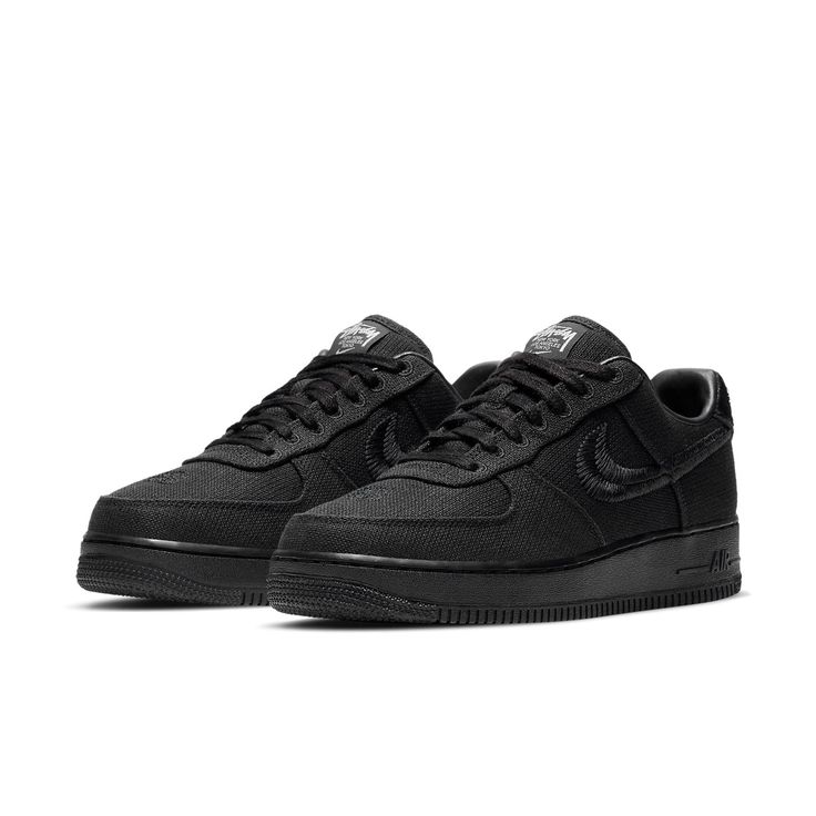 The Nike Stussy x Air Force 1 Low 'Triple Black' is a sleek and stylish sneaker that's perfect for everyday wear. With its breathable hemp construction, this sneaker is comfortable and easy to wear, while the split-embroidered Swoosh and Stussy's double S logo add a touch of style. The interlocking letters on the heel tab and tongue tag are also a nice touch, while the World Tour iconography on the tongue tag is a nice finishing touch. Carbon Color Lace-up Sneakers With Boost Midsole, Nike Air Force 1 With Modern Style, Modern Nike Air Force 1 With Boost Midsole, Dynamic Carbon Sneakers With Cushioned Footbed, Modern Nike Air Force 1 With Cushioned Footbed, Black Low-top Nike Air Force 1 For Light Sports, Carbon Color Casual Sneakers For Streetwear, Black Nike Air Force 1 Low-top Breathable, Black Textile Sneakers For Sports