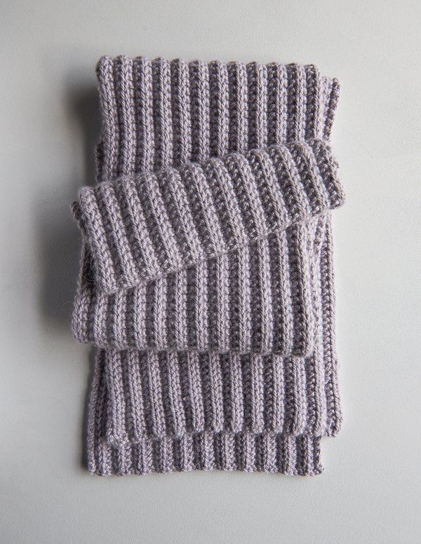 three gray knitted napkins sitting on top of each other