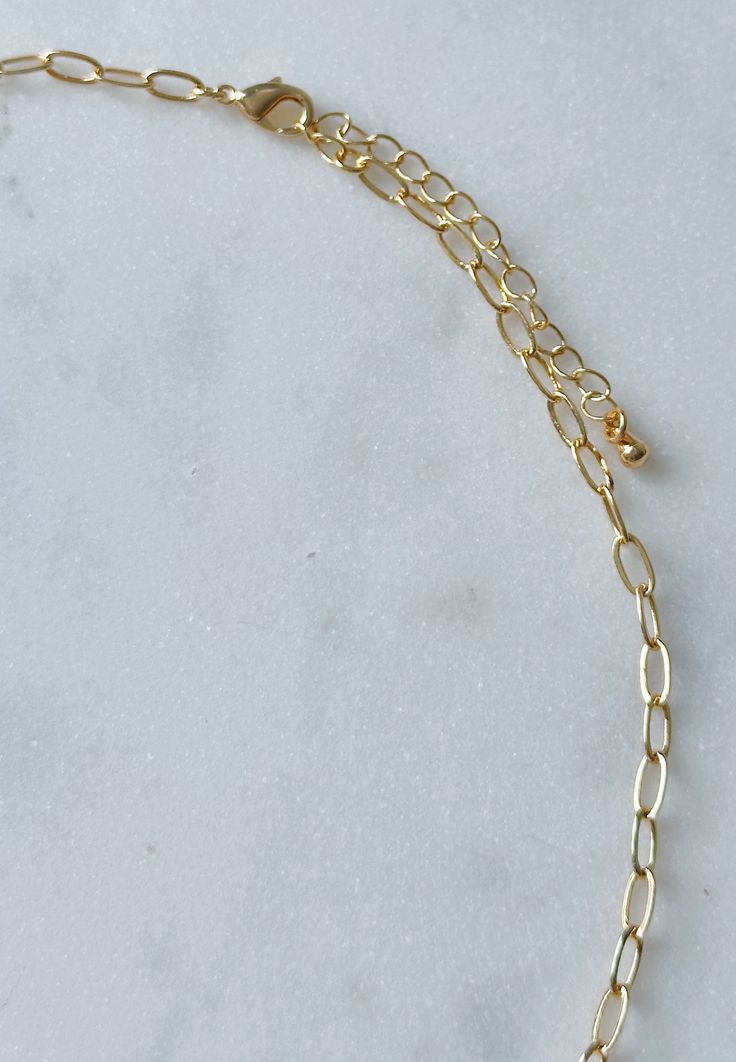 This dainty gold paperclip chain necklace is the perfect everyday accessory and can be effortlessly layered with other necklaces. Necklace is 16 inches long with a 2 inch extender. Delicate 14k Gold Filled Paperclip Chain Jewelry, Delicate 14k Gold-filled Paperclip Chain Jewelry, Dainty Charm Necklace With Cable Chain And Oval Link, Everyday Charm Necklace With Delicate Link Chain, Dainty 14k Gold Filled Chain Necklace For Everyday, Dainty Paperclip Chain Link Charm Necklaces, Dainty Charm Necklaces With Paperclip Chain, 14k Gold Filled Paperclip Necklace With Adjustable Chain, Dainty Paperclip Chain Link Charm Necklace