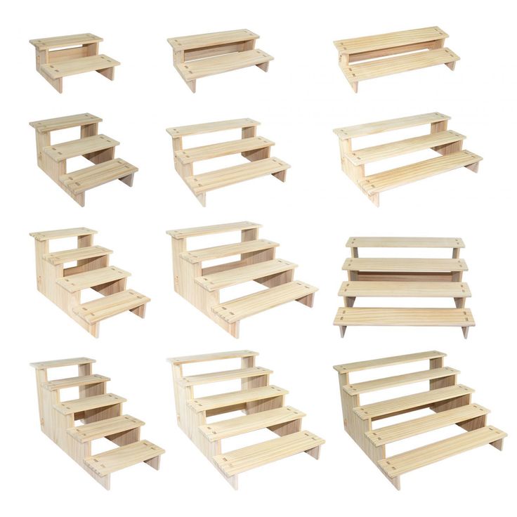 a bunch of wooden shelves sitting next to each other on top of a white surface