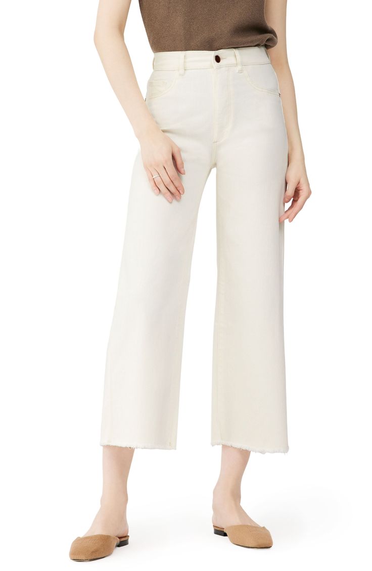 Swingy and sophisticated with a leg-lengthening high rise, these brilliant white wide-leg jeans end in ultra-frayed hems for a look that easily dresses up or down. 27" inseam; 20" leg opening; 11 1/2" front rise; 15" back rise (size 29) Zip fly with button closure Five-pocket style 67% cotton, 31% modal, 2% elastane Hand wash, dry flat Imported t.b.d. White Wide Leg Pants With Five Pockets, Elegant Wide-leg Flare Jeans For Spring, White High-rise Flare Jeans With Frayed Hem, White High Rise Flare Jeans With Frayed Hem, White Mid-rise Pants With Frayed Hem, White High Waist Flare Jeans With Frayed Hem, White High-waist Flare Jeans With Frayed Hem, White Cotton Cropped Flare Jeans, White Cotton Wide Leg Pants With Five Pockets