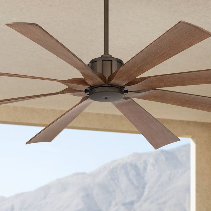 PRICES MAY VARY. 70" blade span. 12-degree blade pitch. 120 x 25mm size DC motor. Full-function hand-held remote control is included. Oil-rubbed bronze finish motor. Eight hand-painted koa finish molded ABS blades. Minimum 9-foot ceiling height required. 8" downrod included. Fan height is 14 3/4" ceiling to blades, 17 1/4" ceiling to bottom of fan (with 8" downrod). Damp location rated large ceiling fan. Not suitable for locations in humid climates with salt water exposure. The Defender outdoor Porch Gazebo, Farmhouse Ceiling Fan, Large Ceiling Fans, Ceiling Fans Without Lights, Ceiling Fan Design, Country Cottage Style, Outdoor Ceiling, Home Porch, Ceiling Fan With Remote