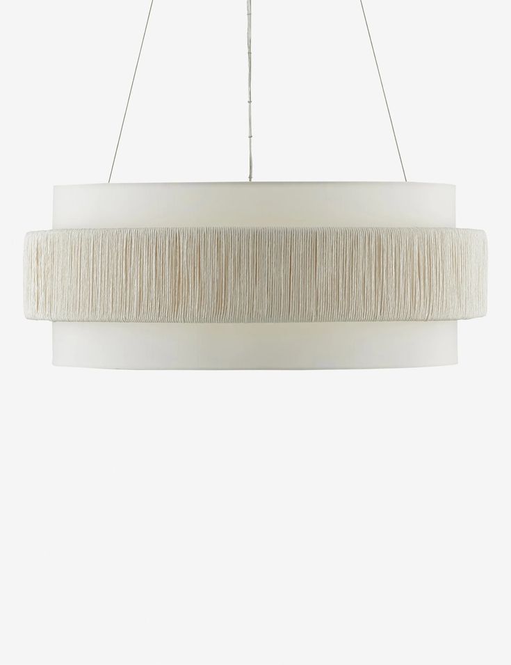 a white light hanging from a ceiling fixture with fringes on the bottom and sides