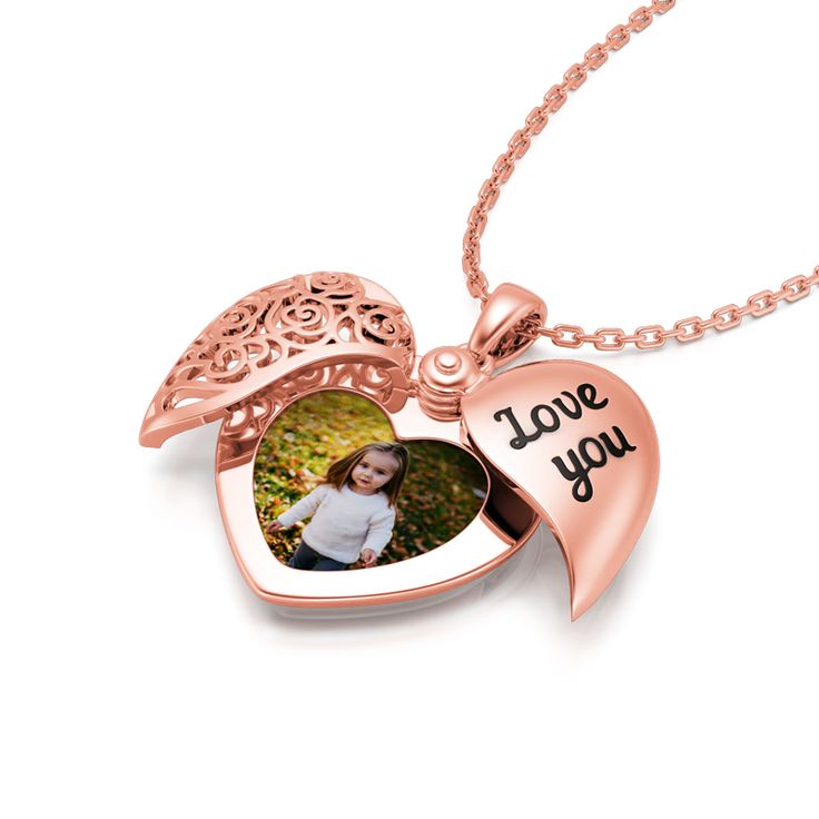 This photo necklace is perfect for making memories last forever. Don't miss this romantic and delicate piece! Unique, special and beautiful, this heart locket necklace is cleverly designed with one half engraved with "Love You" and one half designed as a floral totem. The necklace is crafted in sterling silver with stunning detailing, and with the addition of your own photo, this beautiful piece will be even more memorable.Weight: 4.9 gWidth: 17.6 mmHeight: 23.9 mmThickness: 5.1 mmMaterial: 925 Luxury Heart Shaped Locket Necklace For Wedding, Rose Gold Locket Necklace With Charms For Gift, Personalized Open Heart Locket Necklace For Weddings, Rose Gold Charm Necklaces With Locket For Mother's Day, Rose Gold Locket Charm Necklaces For Mother's Day, Rose Gold Locket Charm Necklace For Mother's Day, Double Heart Locket Necklace For Mother's Day Anniversary, Double Heart Locket Necklace For Anniversary On Mother's Day, Double Heart Locket Necklace For Anniversary And Mother's Day