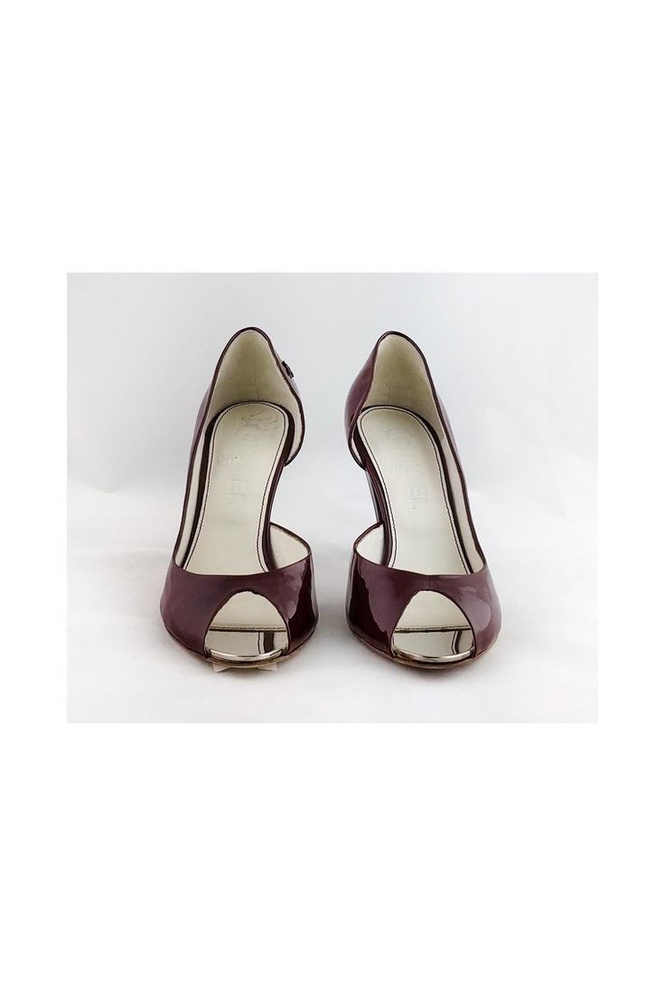 Be bold when you slip into these fabulous burgundy patent leather pumps. They are a stand out choice that pair well with little black dresses. Size 6.5 C (IT 36.5) Patent leather upper & leather sole Made in Italy Open toe Metallic lining by toe Metallic detail on back of heel "CC" logo on side of shoes Light marks on leather Black mark on side of right shoe Some outsole wear Heel height 3.5" Burgundy 4-inch Heels For Office, Open Toe Patent Leather Court Shoes With Padded Heel, Burgundy Almond Toe Heels With 4-inch Heel, Classic Open Toe Patent Leather Heels, Evening Burgundy Heels With Round Toe, Elegant Burgundy Open Heel Heels, Classic Burgundy Almond Toe Heels, Burgundy 4-inch Heels For Evening, Burgundy Open Heel Evening Heels