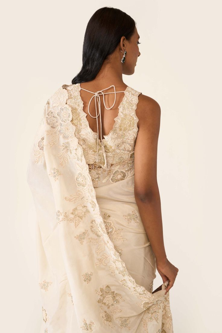 The ivory sari features cutwork organza appliqué with tonal threadwork. It is embellished with pearls beads and swarovski and is paired with blouse with tonal thread and bead work. Ivory Sari, Pearl Work Saree, Varun Bahl, Floral Saree, Blouse For Women, Work Sarees, Embroidered Applique, Saree With Blouse, Floral Applique