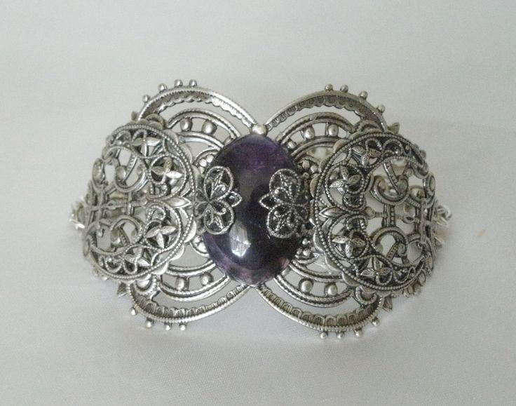 "This beautiful silver plated filigree cuff bracelet has a silver plated triple moon design, amethyst setting with silver plated embellishments and silver plated chain. 6\" long adjustable to 9\" long. Silver plated lobster clasp." Dragons Breath Fire Opal, Wicca Jewelry, Goddess Bracelet, Triple Moon Goddess, Amethyst Set, Jewelry Gothic, Goddess Jewelry, Moon Bracelet, Wiccan Jewelry