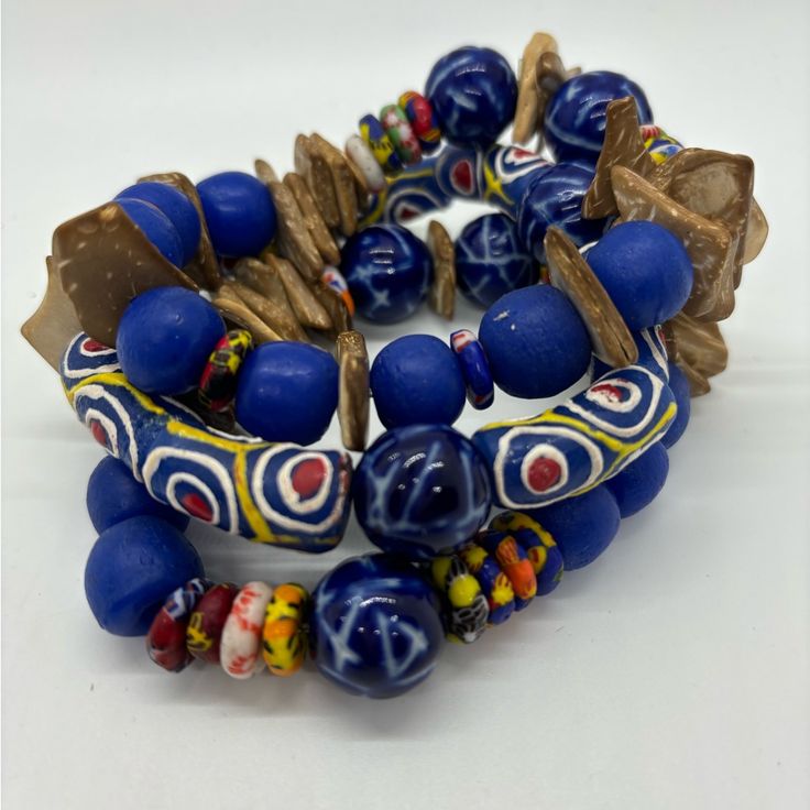 Beautiful Bright Blue Triple Bracelet Stack With Beads From Ghana. This Bright Blue Delight Is Pleasing To Behold And Goes Weary Well With A Variety Of Colors! Adjustable Blue Beaded Bracelets With Wooden Beads, Blue Wooden Beaded Bracelets For Beach, Blue Bohemian Beaded Bracelets With Large Beads, Blue Bohemian Beaded Bracelets With Wooden Beads, Bohemian Blue Beaded Bracelets With Wooden Beads, Bohemian Large Blue Beads, Bohemian Blue Bracelets With Wooden Beads, Adjustable Blue Beaded Bracelets With Large Beads, Hand-strung Blue Beaded Bracelets