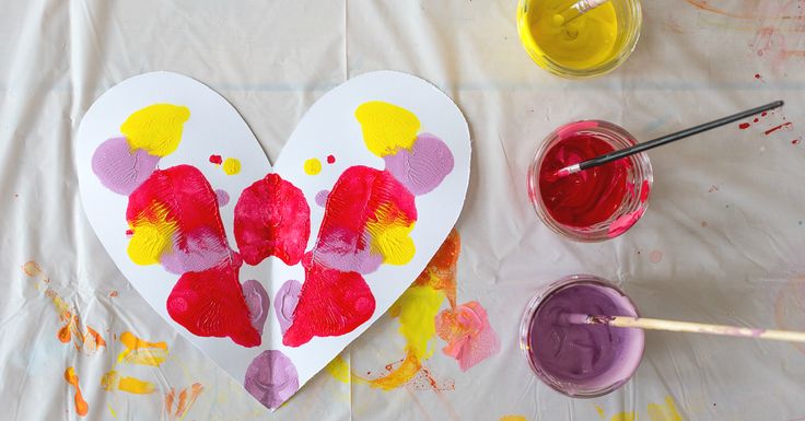 a heart shaped paper plate with paint on it