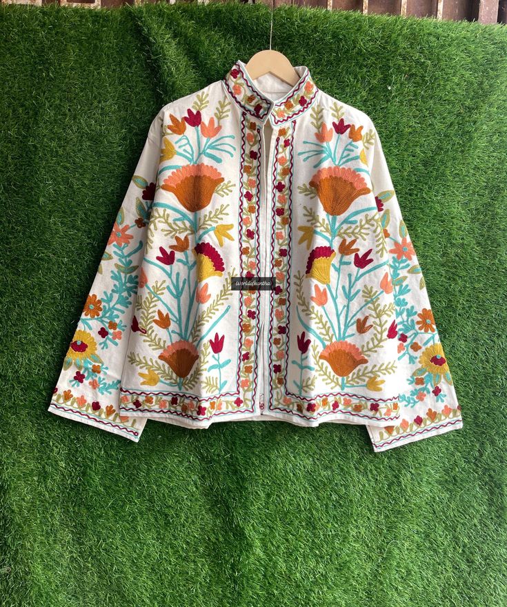 Please Message us for CUSTOM WHOLESALE BULK ORDERS  Materials:-cotton  Jacket made with Embroidery Jacket which is fresh and new. This kantha fabric is hand stitched and it is the specialty of this piece. This jacket is not reversible. We will provide you a matching color string to close this jacket which gives it awesome look. Wear it with any black and white dress, or with jeans to add color and beauty. Handmade in India. Measurements or Sizes: Length- 27 Inches / 70 cm Bust-44 inches / 112 cm Fall Multicolor Embroidered Nehru Jacket, Traditional Outerwear With Resham Embroidery For Spring, Traditional Spring Outerwear With Resham Embroidery, Long Sleeve Nehru Jacket With Intricate Embroidery For Spring, Spring Nehru Jacket With Intricate Embroidery And Long Sleeves, Traditional Nehru Jacket With Floral Embroidery For Spring, Nehru Jacket With Multicolor Resham Embroidery For Fall, Traditional Spring Nehru Jacket With Floral Embroidery, Multicolor Resham Embroidered Nehru Jacket For Fall