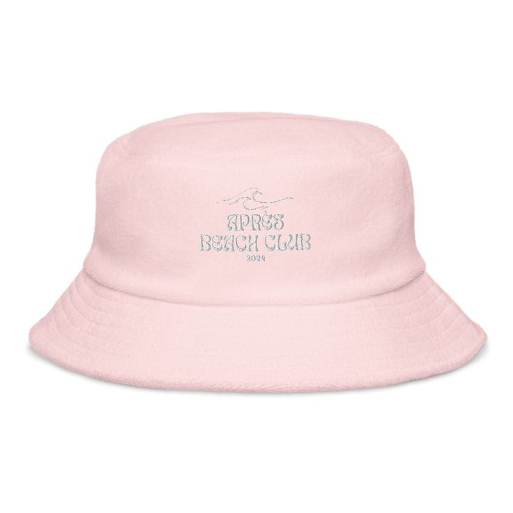 a pink bucket hat with the words beach club on it's front and side