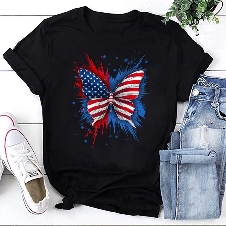 Introducing our Patriotic Butterfly Tee, where the beauty of nature meets national pride in a stunning design. This eye-catching t-shirt features an illustration of a butterfly adorned in the vibrant colors of the American flag, capturing the spirit of freedom, strength, and unity. Perfect for those who love to showcase their patriotic spirit in a unique and artistic way. Crafted with meticulous attention to detail, our Patriotic Butterfly Tee offers both style and comfort. Made from premium, so Multicolor Flag Print Casual T-shirt, Casual Multicolor Tops For Independence Day, Multicolor American Flag Print Crew Neck Top, Black Top With Flag Print For Independence Day, Black Independence Day Flag Print Top, Black Independence Day Top With Flag Print, Multicolor American Flag Print Short Sleeve T-shirt, Multicolor American Flag Tops For Summer, Multicolor Crew Neck T-shirt With American Flag Print