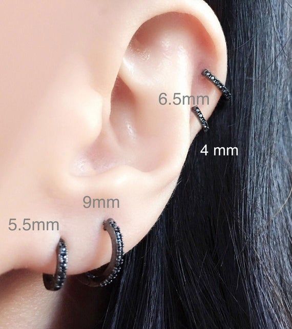 Black Diamond CZ Pave Single Huggie Hoop Earrings. Easy One Touch Click and Lock.**Sold as a ONE SINGLE Piece** If you want to purchase as a pair, please select "2" for Quantity in the drop down menu**Select from 4 Sizes & 4 Colors: Mini, Teeny, Tiny & Small(*Note: Mini size is very very small. Meant to fit piercings that are very low on the lobe. Made for someone looking for the smallest huggie size earring ever! Best to measure mm from piercing to edge of ear)Metal: 925 Sterling Silver Black Small Hoop Earrings Internally Threaded, Elegant Black Hypoallergenic Piercings, Black Sterling Silver Hoop Earrings For Everyday, Black Round Cartilage Earrings For Everyday Wear, Gift Black Internally Threaded Hoop Earrings, Everyday Black Sterling Silver Hoop Earrings, Nickel Free Black Sterling Silver Piercings, Black Round Sterling Silver Cartilage Earrings, Nickel-free Black Huggie Jewelry