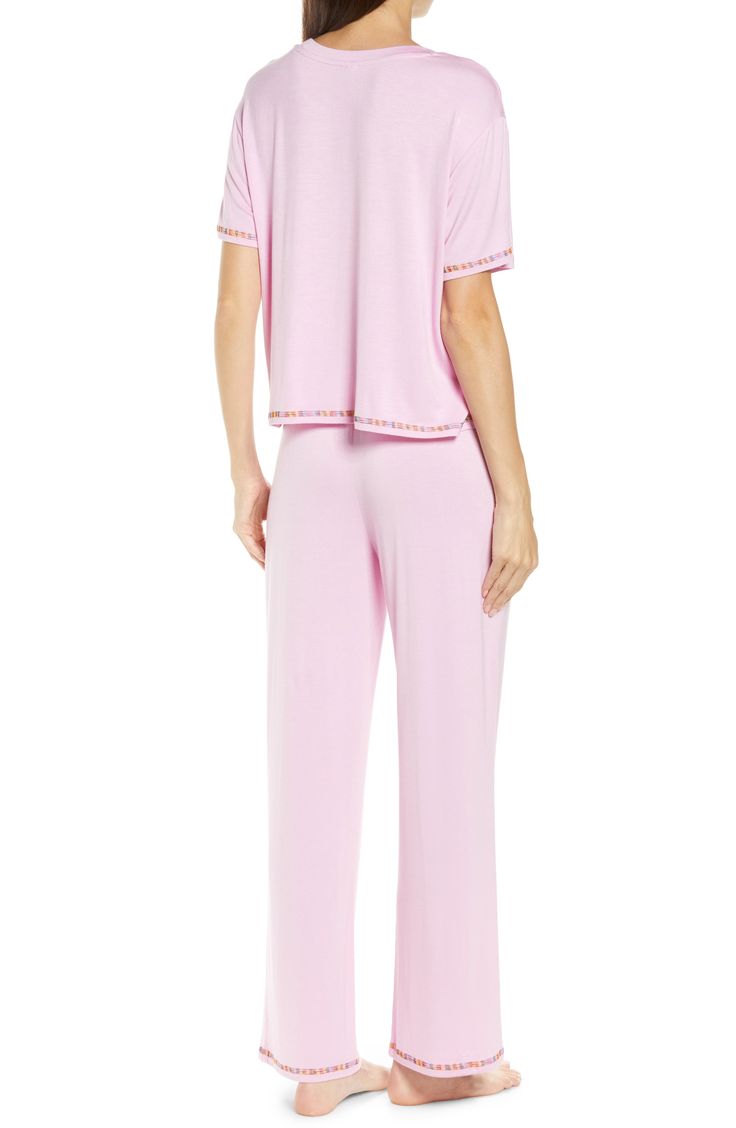 Short-sleeve pajamas in a blissfully soft knit you'll want to live in are traced with colorful embroidery. 21 1/2" top length; 28" inseam; 10 1/2" leg opening; 11 1/2" front rise; 14 1/2" back rise Top has crewneck; short sleeves Pants have drawstring waist 95% rayon, 5% spandex Machine wash, line dry Imported Feminine Short Sleeve Sleepwear With Relaxed Fit, Feminine Relaxed Fit Short Sleeve Sleepwear, Comfortable Fitted Sleepwear For Loungewear, V-neck Tops For Sleepover In Spring, V-neck Tops For Spring Sleepover, Short Sleeve Spring Loungewear Sleepwear, Spring Loungewear Sleepwear With Short Sleeves, Feminine Short Sleeve Loungewear Sets, Feminine Tops For Sleep With Relaxed Fit