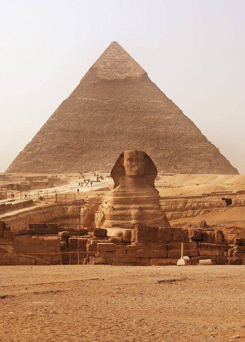 the great sphinx in front of the pyramids at giza