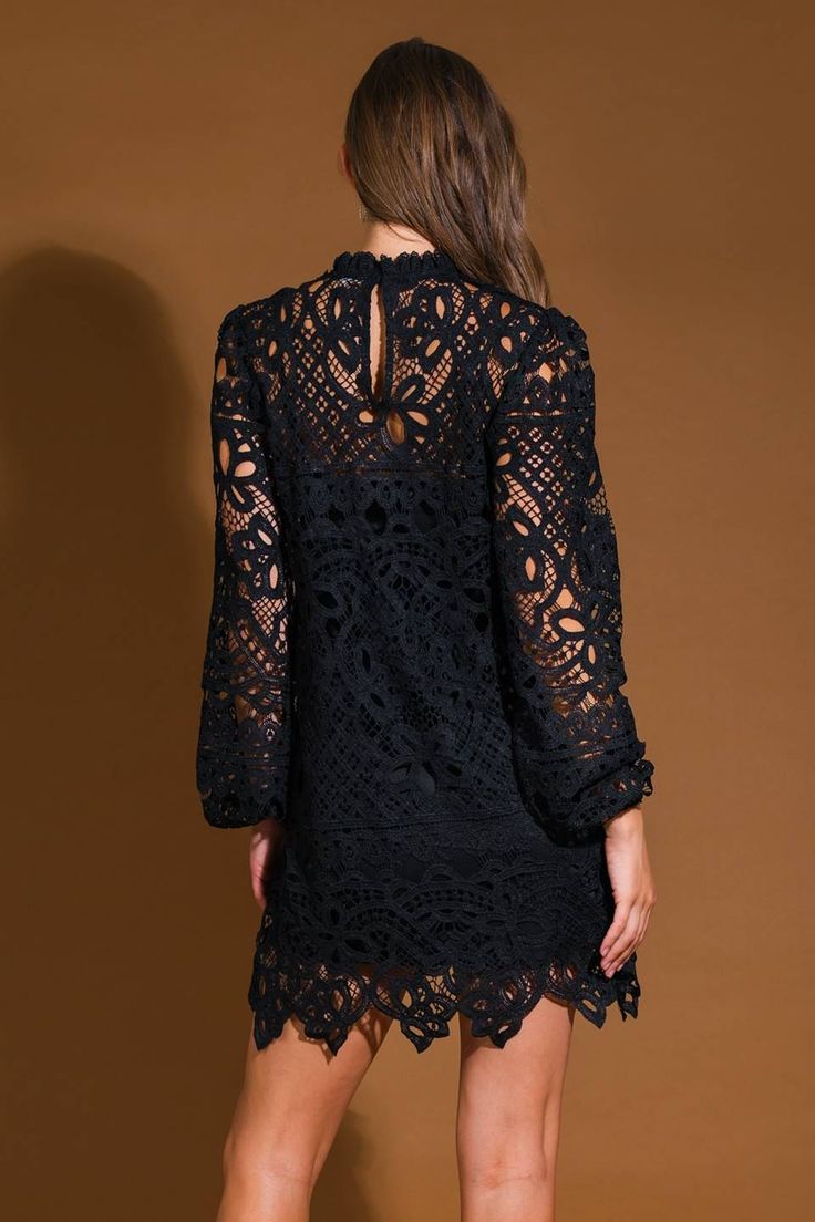 A woven lace mini dress featuring, high neckline, long sleeve, cami and back neck button closure Details: Self : 100% PolyesterLining: 100% Polyester Size & Fit - Model is 5`9" And Wearing Size Small- Measurements Taken From Size Small- Approx. Length: 36" December Wedding Guest Dress, Champagne Gold Dress, Winter Wedding Guest Dress, Winter Wedding Guests, December Wedding, Formal Party Dress, Dinner Dress, Guest Dress, Back Neck