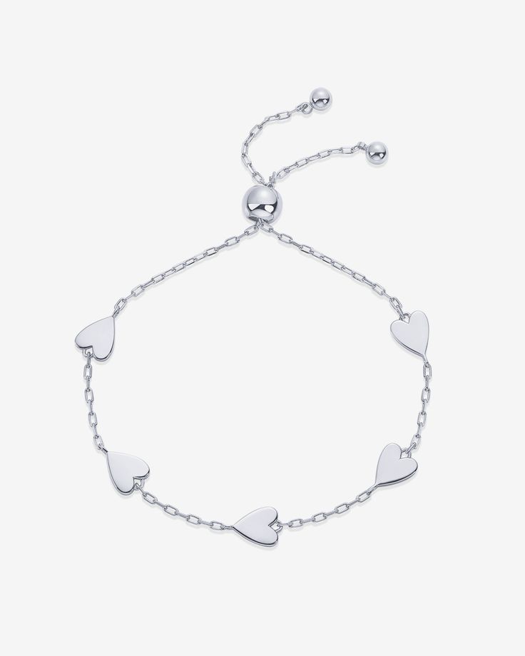 Our chic heart charm bracelet is perfect for modern romantics! Crafted with dainty hearts, it's a versatile and stylish accessory that adds a touch of glamour to any outfit. Ideal for gifting on birthdays, Valentine's Day, or any occasion. Materials: 14K Yellow Gold or Rhodium plated Measurements: Heart Charms: 6.7mm; Bracelet Length: 6" + Extender: 1.5" Hypoallergenic; nickel, lead, and cadmium free Elegant Stainless Steel Charm Bracelet For Friendship, Elegant Adjustable Stainless Steel Heart Bracelet, Mother's Day Metal Bracelets With Adjustable Chain, Trendy Metal Bracelets For Mother's Day, Elegant Adjustable Hypoallergenic Heart Bracelet, Elegant Hypoallergenic Adjustable Heart Bracelet, Nickel-free Elegant Charm Bracelet For Friendship, Elegant Heart Bracelet With Adjustable Chain, Minimalist Adjustable Chain Bracelet For Valentine's Day